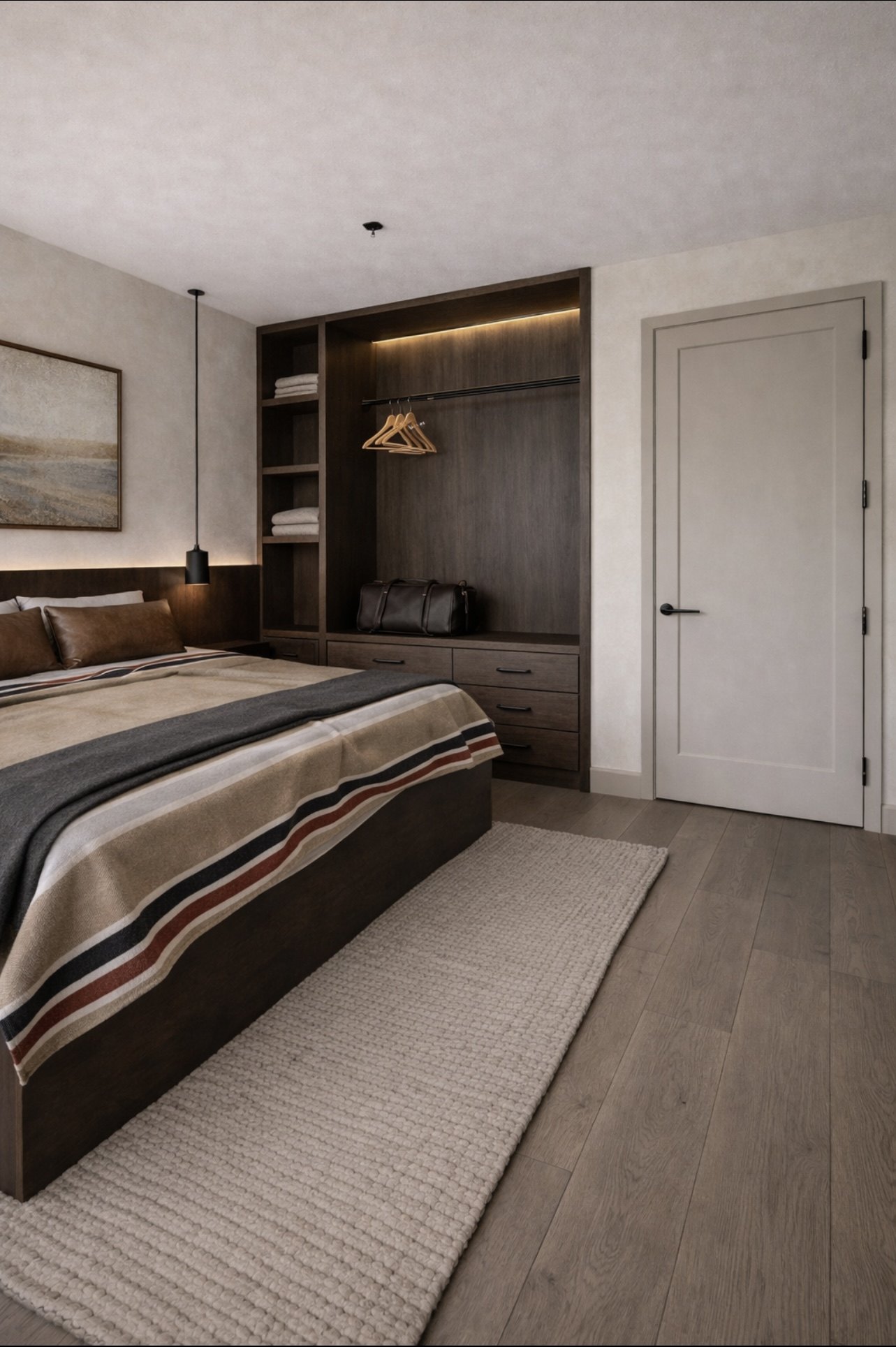 King bedroom with wood paneling and luxury linens